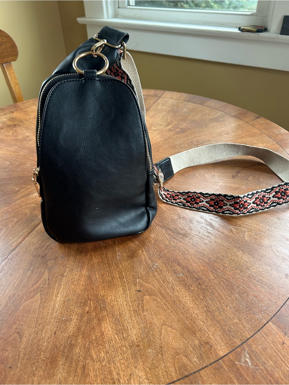 Woman’s cross body bag with lots of compartments and adjustable strap, perfect c